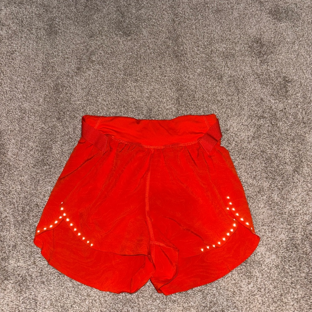 Lululemon embossed Orange track shorts 2”